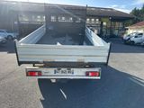 a white truck that is parked in a parking lot