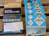 many books on a wooden table with a car in the background