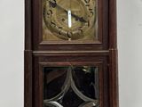 a clock that is hanging on the wall in the room
