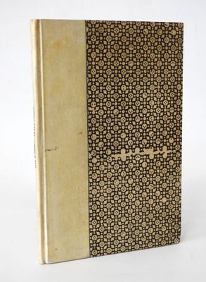an old book with a brown cover and a pattern on it