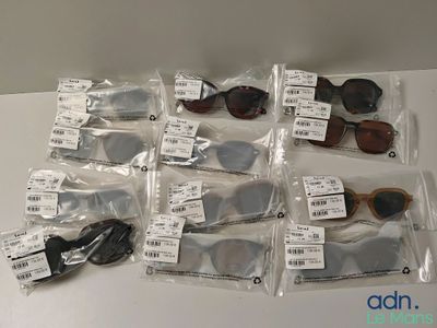 a lot of sunglasses that are on the table