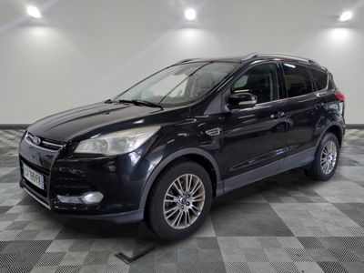 the black ford kuga is parked on a checkered tile floor
