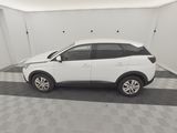 a picture of a white car parked in a garage