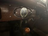 a close up of a steering wheel and dashboard of a car
