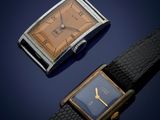 an image of a couple of watches sitting next to each other