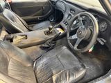 a picture of a car with leather seats and a steering wheel