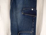 jeans hanging on a clothes rack in a white shirt and jeans