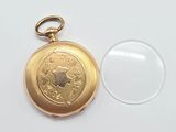 a gold locke with a picture of a woman on it