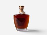 an image of a bottle of brandy sitting on a white surface