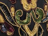 a close up of a dress with sequins on it