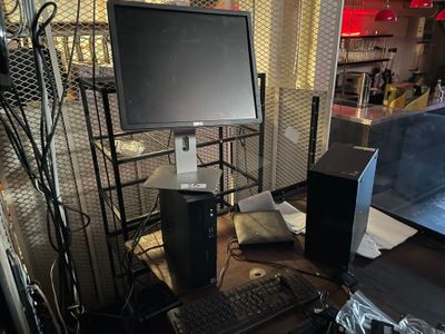 an image of a computer desk with a monitor and keyboard