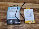 a box of batteries and a charger on a wooden table