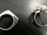 two rings that are sitting on top of a table