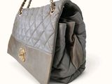 an image of a grey purse with a gold chain