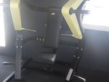 a picture of a gym room with a bench and exercise equipment