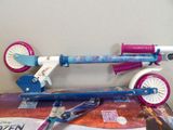 a toy scooter that is sitting on top of a box