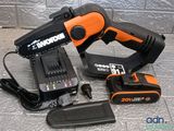an image of a corded drill and a charger on a tiled floor