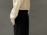 an image of a mannequin wearing a white shirt and black skirt