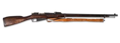 un fusil avec un canon en bois sur fond blanc