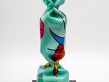 a glass vase with a colorful design on it