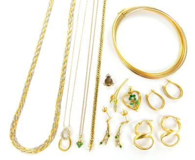 a lot of gold jewelry on a white surface