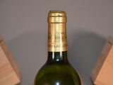 a bottle of wine that is sitting on a table