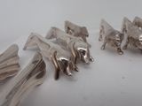 a lot of spoons that are sitting on a table