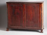a wooden cabinet with two doors on one side and a drawer on the other side