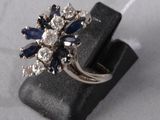 an image of a ring with blue and white stones