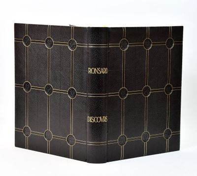 the front cover of a black book with gold writing on it