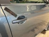 a sticker on the door handle of a car