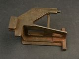 a metal stapler that is on top of a table