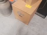a person standing next to a pile of boxes on the floor
