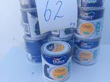 several cans of blue paint are stacked on top of each other