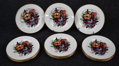 six plates with a picture of a cat and flowers on them