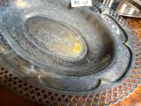 a metal bowl on a table with a price tag on it