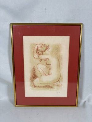 dessin représentant une femme nue assise à genoux, dans un cadre doré