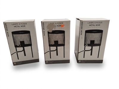 three boxes with a black and white picture of a lamp on top of a table