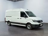 the white van is parked in the empty room of the building
