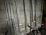 a bunch of pipes that are lined up against a wall