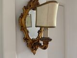 a mirror on the wall above a sink in a bathroom