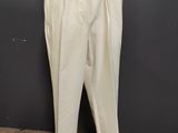 a mannequin mannequin with white pants on a wooden stand