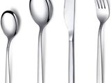 quatre cuillères, une fourchette et une cuillère sur fond blanc