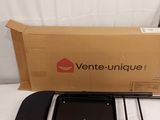 an image of a box of ventte unique products sitting on top of a bed