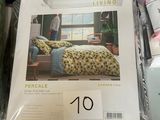a lot of bedding on display in a store