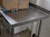 a table with a box on it and a carton of boxes on top of it