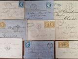 several old envelopes are sitting on top of a wooden table