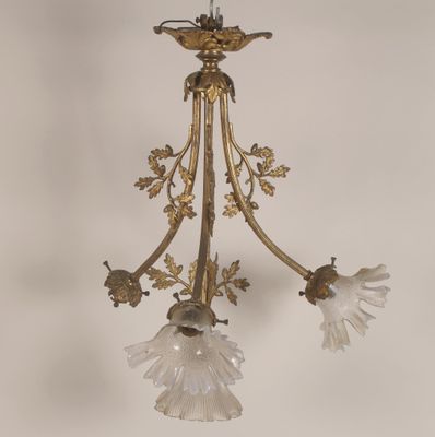 Lustre en bronze et régule patiné à quatre bras de lumières …