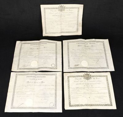 four certificates of various sizes and shapes on a black background