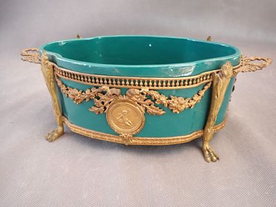 an image of a blue bowl with a gold decoration on it